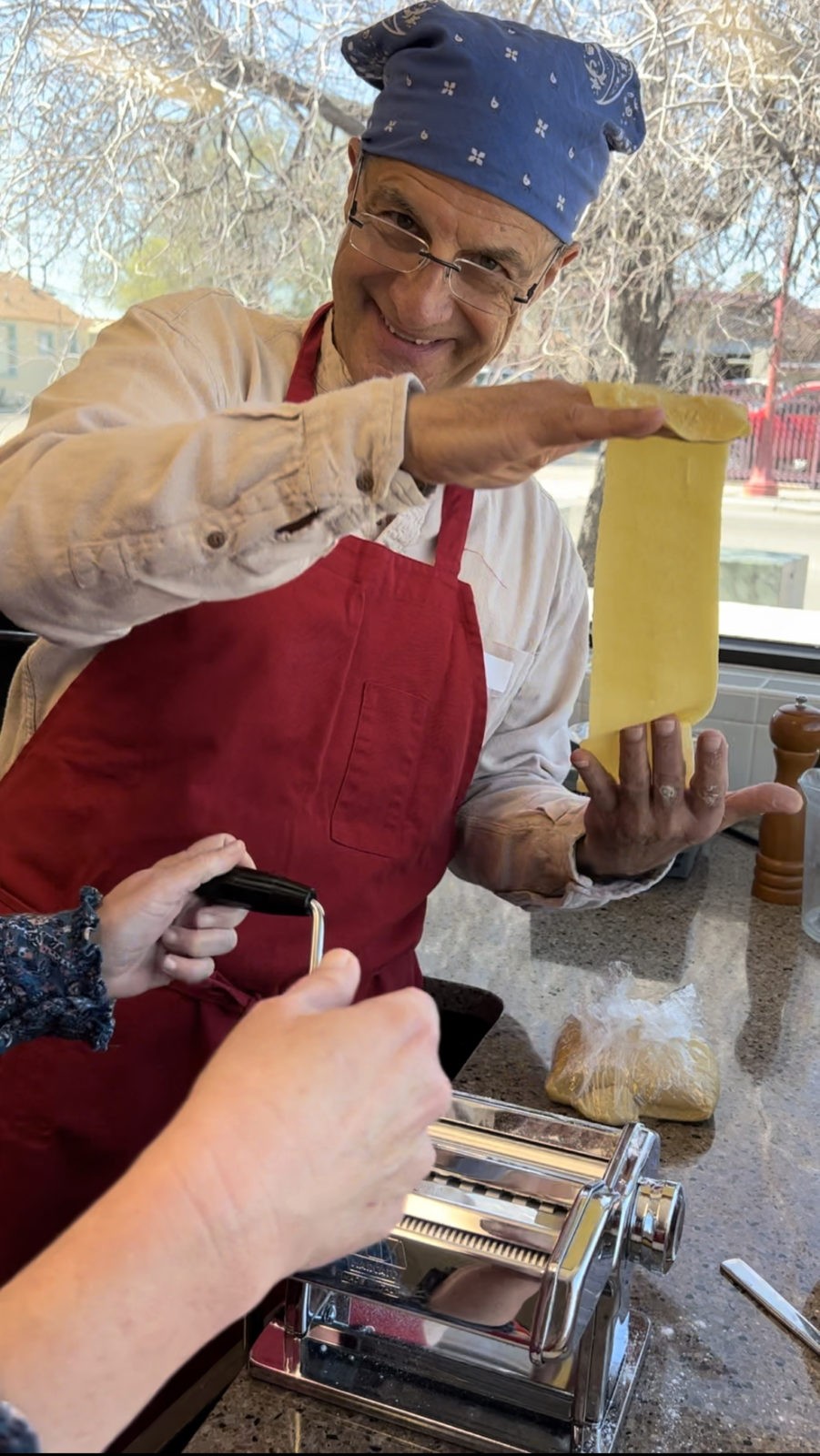 A participant rolls out homemade pasta during a Hands On Cooking Class at The Garden Kitchen.